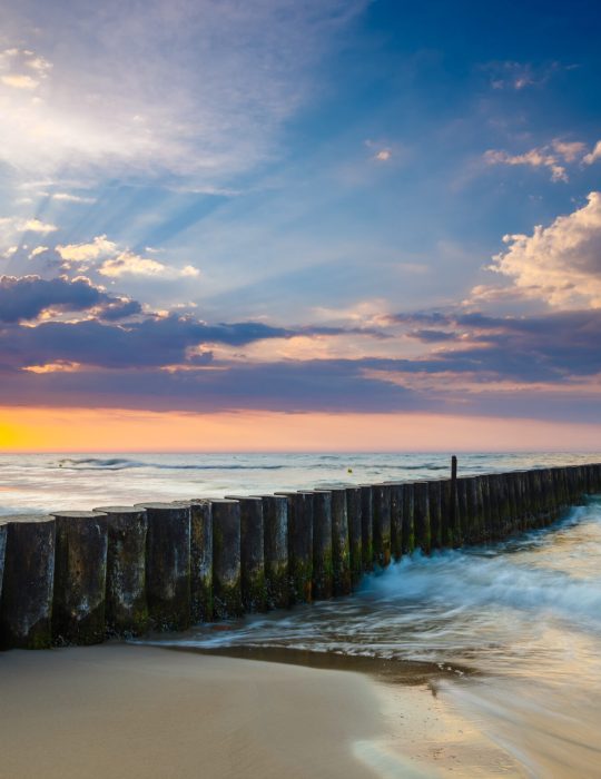 sunset-on-the-beach-with-breakwater-long-time-exp-2026-03-26-02-36-08-utc